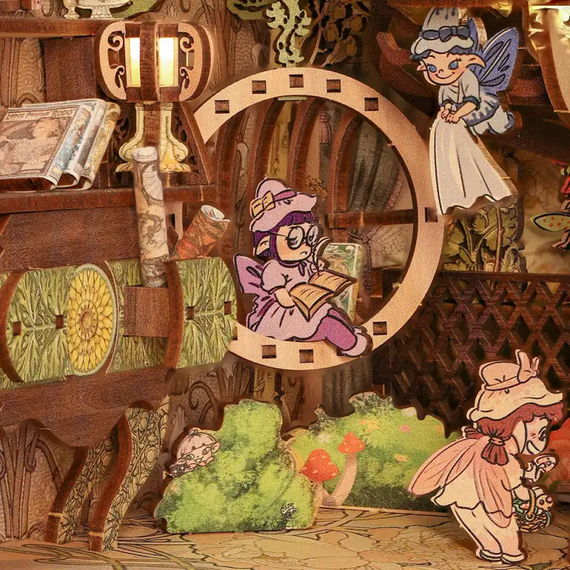 Diorama d’une maison de fées en bois avec de nombreuses fées.
