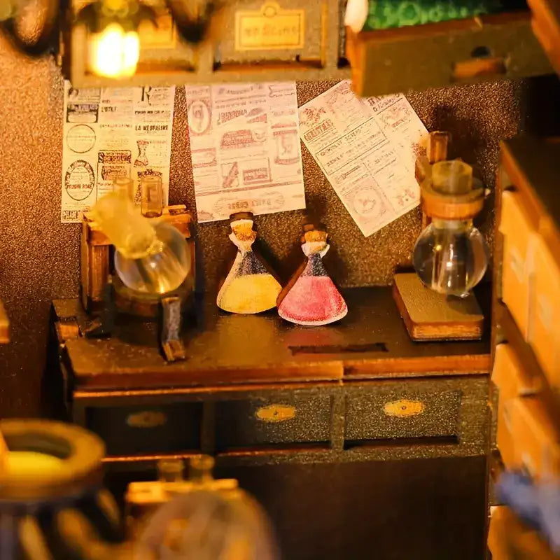 Un établi de laboratoire miniature avec des béchers et des potions.