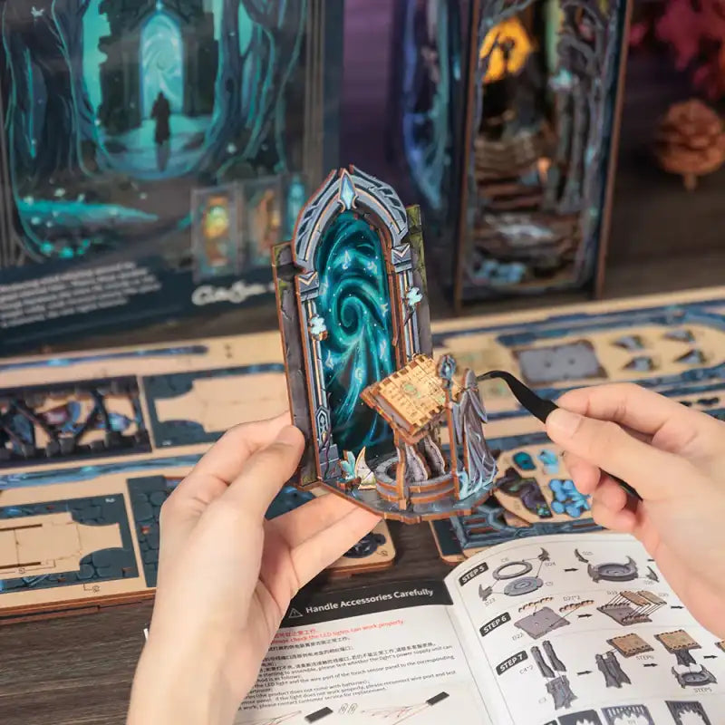 Un kit de diorama miniature à monter soi-même, comprenant un portail et un puits magiques, avec des instructions de montage.