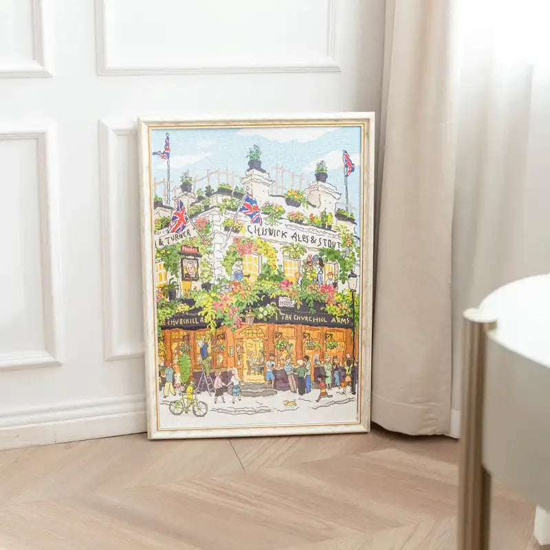 Peinture à l’aquarelle fantaisiste encadrée représentant un charmant pub anglais.