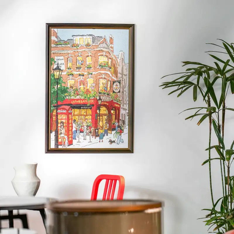 Peinture à l’aquarelle encadrée d’une scène de rue londonienne animée.