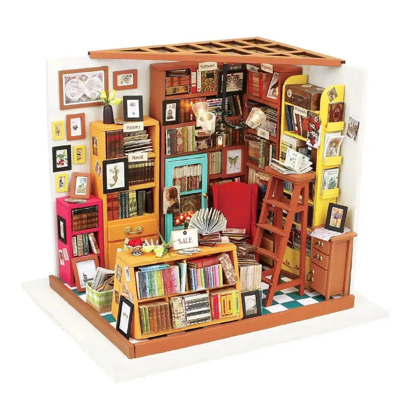 Une maison de poupée miniature en kit, conçue comme une librairie confortable et encombrée.