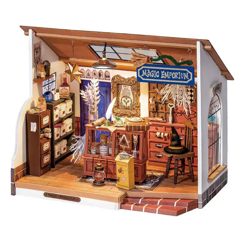 Diorama de magasin de magie miniature avec mobilier intérieur détaillé.