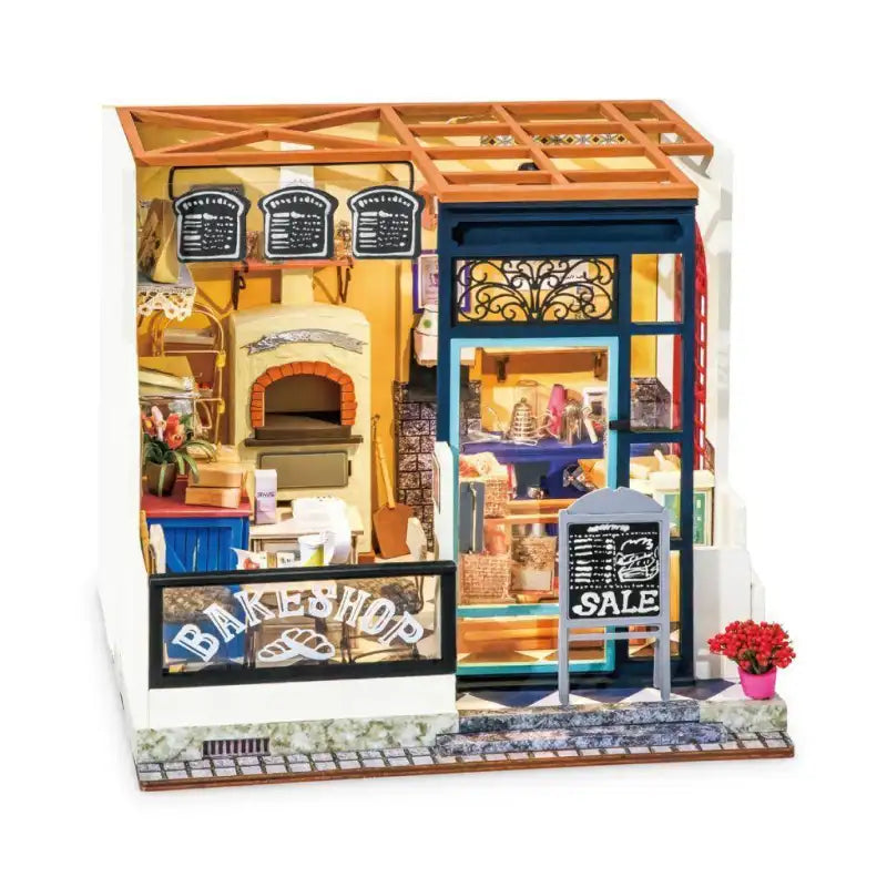 Un kit de maison de poupée miniature en bois représentant une boulangerie et un magasin à deux étages.