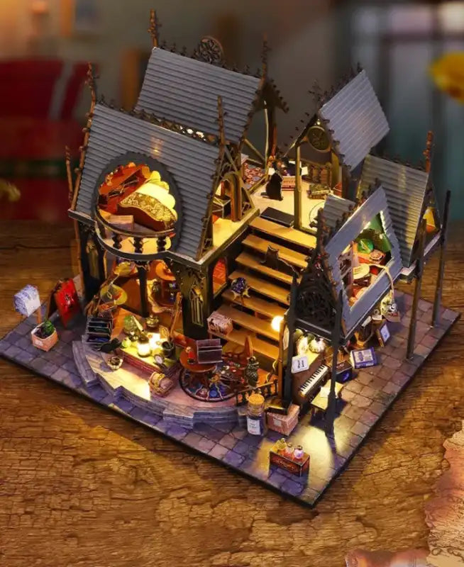 Un modèle miniature illuminé d’un bâtiment à plusieurs étages avec des détails complexes.