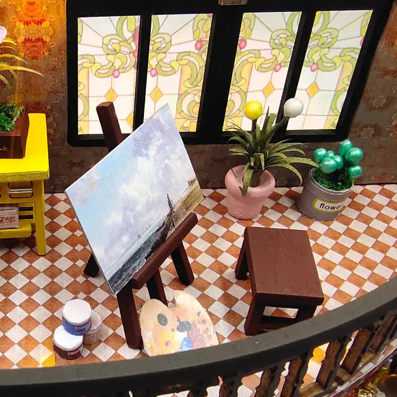 Installation de l’atelier d’un artiste miniature.