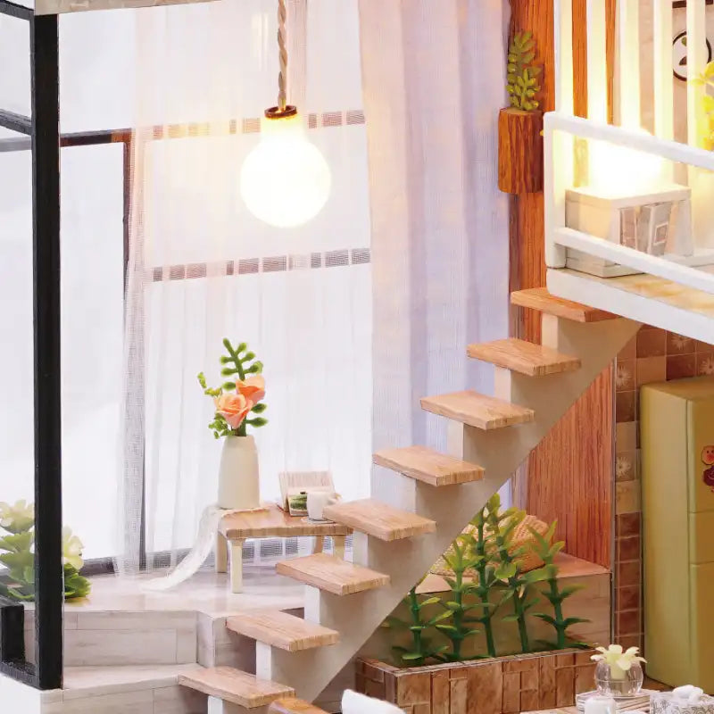 Intérieur de maison de poupée miniature avec escalier et meubles