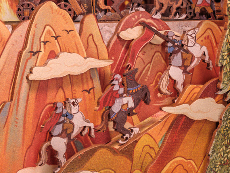 Diorama en papier superposé représentant des guerriers montés dans un paysage montagneux.